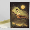 A folded greeting card with an illustrated cover showing a girl riding a flying bat through cloudy night sky with a full moon and stars above a dark forest.