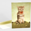 A folded greeting card featuring an illustration of a standing tabby cat with a red bow tie and folded paws on a green background, with a white envelope behind it.