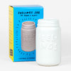 A white ceramic jar with a threaded rim and embossed "FEELINGS" text, shown in front of a blue and yellow box labeled "FEELINGS JAR" and "BY ADAM J. KURTZ."