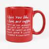 A glossy red ceramic mug with a large handle and white hand-lettered text that reads, "I love you like I love my coffee first in the morning or last at night dark or sweet or both right now & later & always & constantly."
