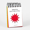 A spiral-bound notepad with a white cover, black hand-drawn style text reading "ENDLESS POSSIBILITIES," a large red starburst graphic, and rainbow-colored page edges.