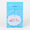 A packaged cloud-shaped air freshener with the text "IMPROVE YOUR LIFE" and "AIR FRESHENER" on the blue header and "JUST BE F*CKING NICE" on the white freshener.