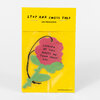 A rose-shaped pink and green air freshener on a yellow backing card, with the text "STOP AND SMELL THIS AIR FRESHENER" and "LOOKING AT THIS MAKES ME THINK ABOUT YOU."