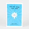 A blue book cover with a white starburst center that reads "YOU ARE HERE *FOR NOW" and "A Guide to Finding Your Way," with the author name "ADAM J. KURTZ" at the bottom.