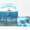 A hardcover book titled "The Secret Life of a Sea Turtle" with an illustrated sea turtle on the cover and a smaller inset image showing a turtle swimming over a coral reef.