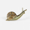 A gold-tone enamel pin shaped like a snail with a spiral shell and an extended body and antennae.