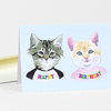 A folded birthday greeting card with two illustrated kittens on the front and the words "HAPPY" and "BIRTHDAY" in colorful letters.