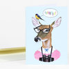 A folded greeting card shows an illustrated deer wearing black glasses and binoculars, with a bird on its head and a speech bubble that says "THANK YOU!".