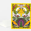 A folded greeting card with a bright yellow cover featuring two white swans, birds, flowers, leafy vines, a peacock, and the text "HAPPY BIRTHDAY".