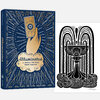 A navy journal with gold and cream illustrated cover art showing a hand holding a tarot card and the text "illuminated" and "A JOURNAL FOR YOUR TAROT PRACTICE," shown beside a black-and-white illustrated print with a signature.