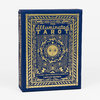 A blue tarot card box with ornate gold decorative artwork and the text "THE Illuminated TAROT," "53 CARDS FOR DIVINATION & GAMEPLAY," and "CAITLIN KEEGAN."