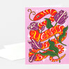 A folded greeting card featuring a red snake wrapped around purple flowers on a pink background with the word “Yes” in the center.
