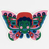 A butterfly-shaped embroidered patch featuring a stylized green face at the center with pink cheeks, blue lips, and multicolored symmetrical wing patterns.
