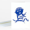 A folded greeting card with a blue illustrated face and shoes integrated into a plant-like design on the front.