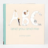 A hardcover book with a cream cover and teal spine shows large illustrated letters "A B C" with people forming each letter, the title "and you and me," and the author name "corinna luyken."