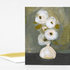 A folded greeting card featuring an abstract floral painting with four white flowers and muted green and black tones on the front.