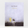 A hardcover book titled "my heart" by Corinna Luyken with an illustration of a child bending down to pick up a small yellow heart from the ground.