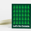 A folded greeting card with a dark green cover patterned with rows of bright green triangular trees and the white text “Let’s Go Outside.”