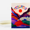 A folded greeting card with a colorful landscape illustration and the text "HAPPY BIRTHDAY YOU ARE THE BEST" on the front, shown with a plain envelope.