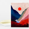 A folded greeting card with an illustrated landscape cover reading "TO NEW ADVENTURES" above a red sun, layered mountains, and a row of dark pine trees at the bottom, with a matching envelope shown behind it.