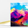 A folded greeting card featuring a colorful abstract mountain landscape with two small hiker silhouettes on a ridge.