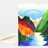 A folded greeting card with a colorful layered mountain-and-river illustration and the text “LET’S GET AWAY TOGETHER” across the top.