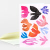 A folded greeting card featuring nine colorful bird illustrations in pink, black, purple, orange, blue, and red-orange.