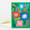 A folded greeting card with a bright green front covered in colorful stylized flowers and curved leaf shapes.