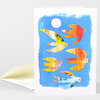 A folded greeting card with a blue painted panel featuring five colorful stylized birds in flight and a white circle near the top.