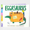 A children’s picture book titled “EGGASAURUS” with an illustrated green dinosaur carrying a large orange box labeled “FRAGILE” and “SPECIAL DELIVERY FOR MAXIMUS,” with the byline “Written by Jennifer Wahg” and “Illustrated by Hallie Bateman.”