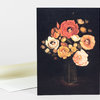 A greeting card with a still life illustration of a dark vase holding a bouquet of large flowers, some with small faces in their centers.