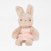 A plush bunny stuffed animal with tall ears, black eyes, a red stitched nose, and a pink floral dress.