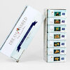 A Dream World Emily Winfield Martin mini puzzle collectors set in a tall box holding seven small puzzle boxes, each labeled "20" and featuring different illustrated scenes.