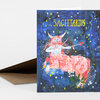 A greeting card with the word "SAGITTARIUS" and a colorful illustrated centaur archer against a starry blue background, shown with a brown envelope.