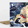 A folded greeting card featuring an illustrated nighttime coastal scene with orcas, a person on a rocky shore, and the text "EVERYTHING WILL BE OK" on the front.