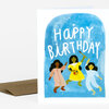 A greeting card with the words "HAPPY BIRTHDAY" above an illustration of three fairies dancing against a blue background.