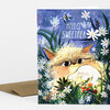 A greeting card with a floral illustration of a furry animal holding a small white rabbit, with the text "HELLO, SWEETPEA" on the front.