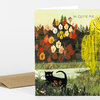 A folded greeting card with an illustrated black cat in grass, colorful autumn trees, and the text "Hi CUTIE PIE" on the front.