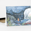 A folded greeting card with an illustrated nighttime desert scene and the words "You are my dream" on the front.