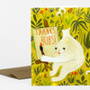 A greeting card with a yellow floral pattern and a white illustrated character holding a sign that says "THANKS, BUBS!" with a brown envelope behind it.