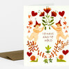 A folded greeting card with the text "TO HAVE AND TO HOLD" and an illustration of two nude figures in pointed hats holding green stems with flowers, surrounded by hearts, leaves, and small snails.