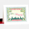 A folded holiday greeting card with a vintage postage-stamp design that reads "SEASON'S AIR MAIL HAPPY NEW YEAR! GREETINGS" and includes small airplane, snowflake, and holly illustrations.