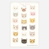 A sticker sheet titled "Tiny Faces Stickers" featuring fifteen small cat face stickers in different colors and expressions, with a copyright line reading "© emily winfield martin.com".