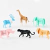 Six colorful standing animal-shaped calendars are shown, including a giraffe, elephant, lion, panther, rhino, and a blue antlered deer, each with a small monthly calendar printed on its body.