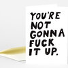 A folded white greeting card with large hand-painted black text reading "YOU'RE NOT GONNA FUCK IT UP."