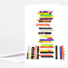 A folded greeting card featuring an illustration of stacked colorful cookbook spines arranged in the shape of a letter or tower, with the artist signature "Jane Mount" at the bottom right.