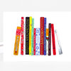A greeting card with a row of illustrated books arranged like a bookshelf, with visible book spines labeled with Christmas titles and authors.