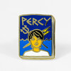 A rectangular enamel pin with a gold-toned outline, blue background, the word "PERCY" at the top, and a stylized portrait of a person with dark hair in the center.