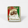 A rectangular enamel pin shaped like a book cover with a Santa face and the text "The Night Before Christmas."