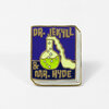 A square enamel pin shaped like a book cover with gold outlines, dark blue panels, and the text "DR. JEKYLL & MR. HYDE," featuring a stylized potion flask illustration in the center.